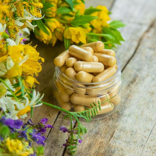 Supplements and vitamins with medicinal herbs. Selective focus.